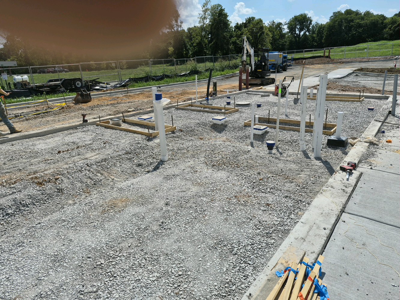 Swig, underground plumbing stub-ups on building pad
